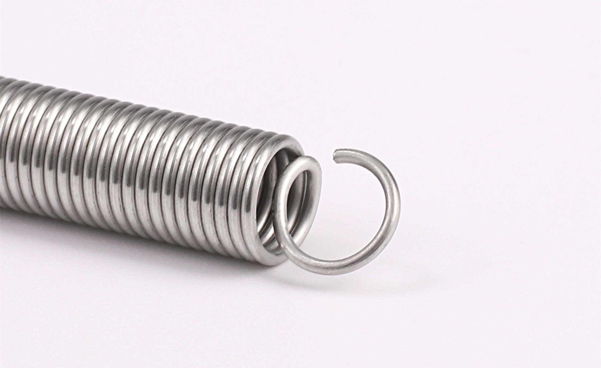 Coil extension, torsion spring manufacturing